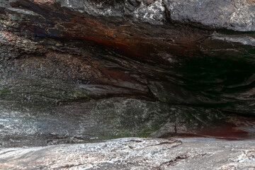 Textured Rock Formation with Layers of Sediment