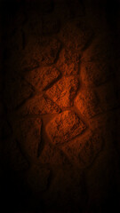 Dark grainy stone wall with a soft orange glow at the center, creating a warm and dramatic effect. Perfect for vertical 4K backgrounds, wallpapers, and banners