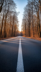 Fototapeta premium AI generator image of Car travel on the road,Road in foggy forest in rainy day in spring. Beautiful mountain curved roadway, trees with green foliage in fog and overcast sky. Landscape with empty asph