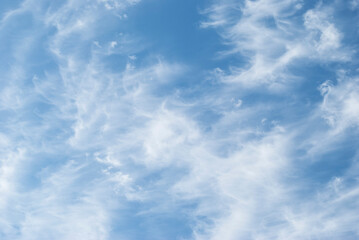 gentle white clouds in the blue sky