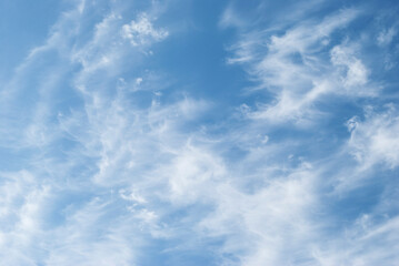 gentle white clouds in the blue sky