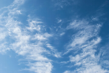 gentle white clouds in the blue sky