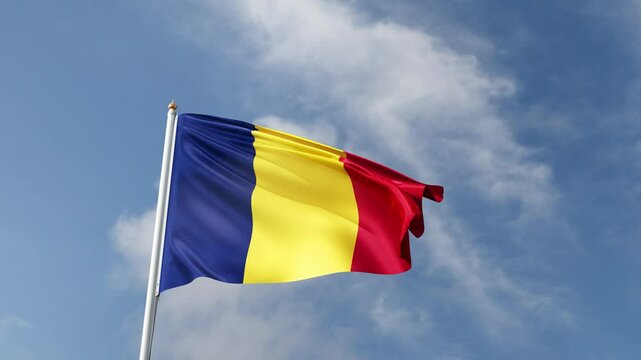 Flag of Chad on a blue sky, flag on a flag pole waving in the wind, african country, national symbol of Tchad, video of a flag	