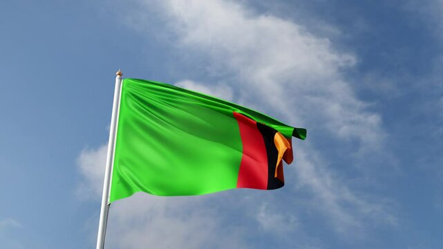 Flag of Zambia on a blue sky, flag on a flag pole waving in the wind, african country, national symbol of Zambia, video of a flag	