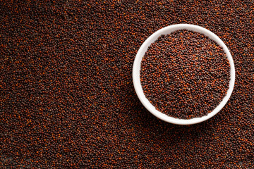 Brassica juncea - Brown mustard seeds in bowl.
