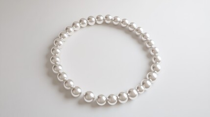 Obraz premium Pearls arranged in a perfect circular trail, set against a minimalist white backdrop, symbolizing grace, purity, and sophistication