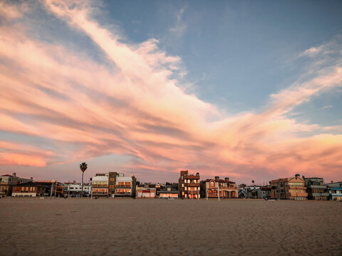 Houses on the strand in Hermosa Beach, California, USA  at sunset as seen from the sand