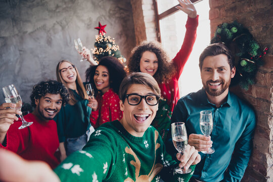 Photo of attractive young people employees take selfie drink champagne new year decoration interior corporate party office