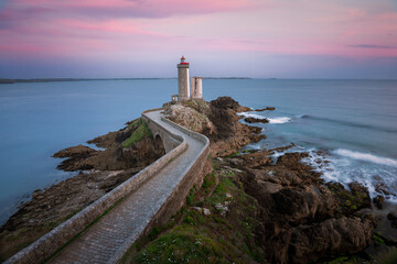 lighthouse on the shore of the sea