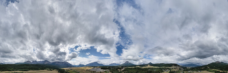Expansive Panorama of Alberta, Canada Featuring Dramatic Clouds Over Rolling Hills and Forests