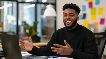 Young entrepreneur passionately pitching to investors over a video call, laptop and notes on the table.