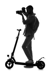 Silhouette of male photographer with camera and electric scooter on white background