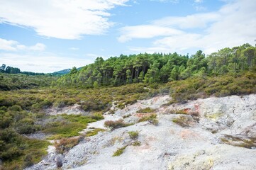 Volcanic landscape with geothermal pools and lush vegitation at War-O-Tapu Rotorua New Zealand 