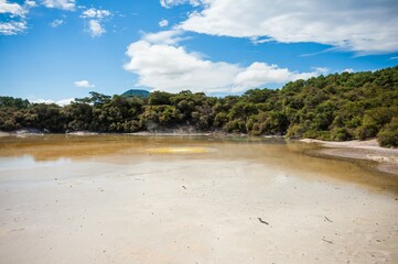 Wai-o-Tapu Rotorua New Zealand Multicoloured rocks reveal themselves beneath the water at Champagne...