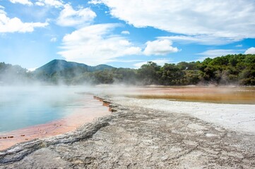 Wai-o-Tapu Rotorua New Zealand Multicoloured rocks reveal themselves beneath the water at Champagne...