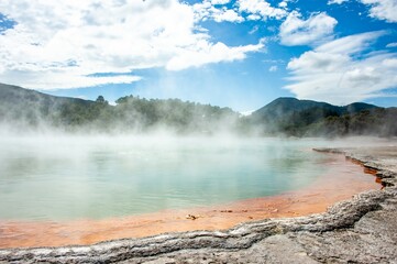 Wai-o-Tapu Rotorua New Zealand Multicoloured rocks reveal themselves beneath the water at Champagne Pool