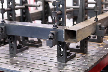 clamps fix the workpieces on slotted welding table