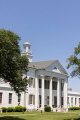Tallulah, Louisiana, USA - April 23, 2024: Afternoon sun shines on the historic 1887 Madison Parish Courthouse of downtown Tallulah.