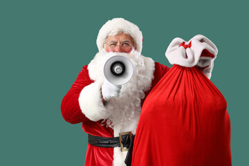 Santa Claus with Christmas bag and megaphone on green background