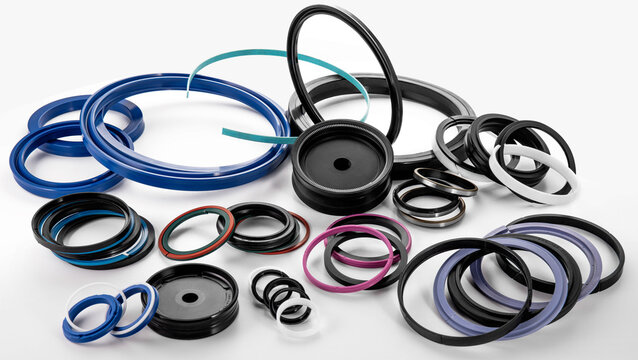 Numerous rubber seals and rings in diverse sizes and colors are arranged together, commonly used in automotive and industrial applications. These components are essential for preventing leaks.