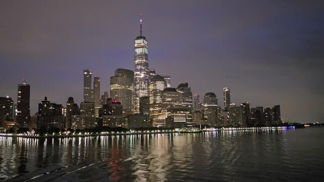 New York City USA night skyline on the hudson river cruise docking into westside highway port 42nd street NYC