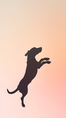 Obraz premium A playful silhouette of a dog jumping, set against a soft pastel background that enhances its outline