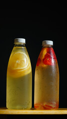 Lemon and strawberry fruits flavored infused water. Summer refreshing drink. Health care, fitness, healthy nutrition