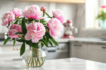 Beautiful Peonies in Vase on Granite Countertop Island in Stylish White Minimal Kitchen with Wooden Shelves in New House