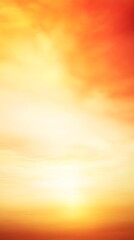 Obraz premium A dramatic sunset scene with vibrant orange and yellow hues, with a clear sky and light solid color background
