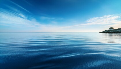 Tranquil blue sea with a distant shore