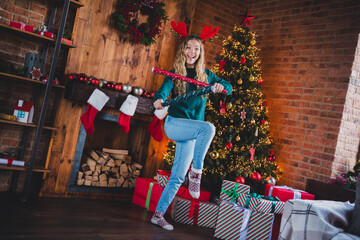 Full size photo of teen girl have fun wrapping paper dressed green christmas outfit day light home...