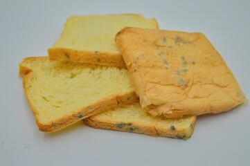 Moldy bread isolated on white background