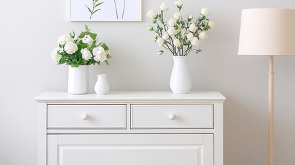 White wooden cupboard, elegantly crafted with a smooth painted finish, featuring stylish handles and ample storage space, perfect for enhancing any room's decor.