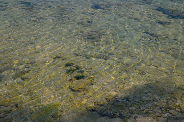 Water pattern on the beach because of the reflection of the sun