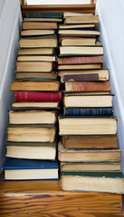 Naklejka premium stack of books on a blue background