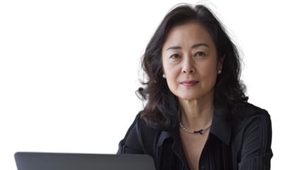 Middle-aged Asian female entrepreneur working on laptop on white background 