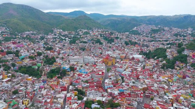 Aerial Odyssey Over Guanajuato: Stunning Drone Footage of Mexico's Colonial Gem, from University to Basilica, Revealing Historic Landmarks and Vibrant City Life.
