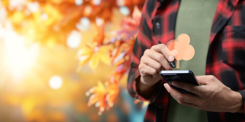An icon of an autumnal tree, featuring branches adorned with warm, orange, yellow, and red leaves, symbolizing the fall season