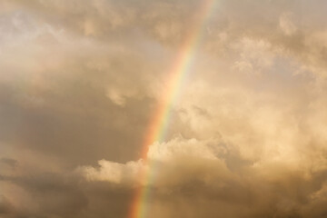 Pastel colored clouds and rainbow in sunset sky. Amazing sky landscape. The sky that gives calmness, happiness and peace.