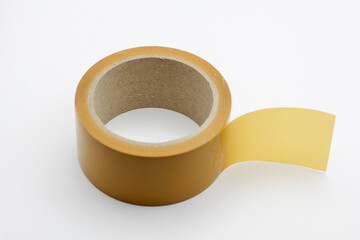 Roll of yellow duct tape on a white background