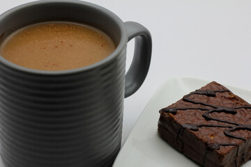 hot chocolate in a cup and chocolate cake
