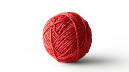 A red ball of yarn sits on a white background