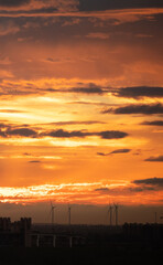 Fototapeta premium The setting sun reddened the sky, the countryside skyline, and the scenery background.