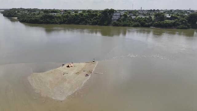 Drone orbits dry patch in middle of Rio Branco river in Boa Vista, Roraima, Brazil