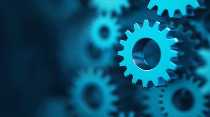 Close-up of vibrant blue gears with a blurred background.
