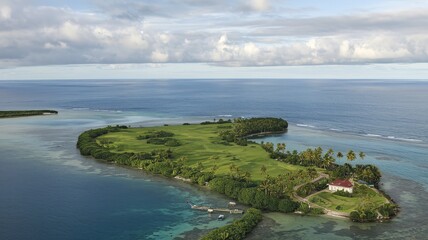 A lush, green tropical island with a winding path along the coastline, surrounded by a vast, blue ocean