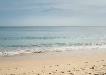 A pristine beach with golden sand leading up to the azure waters