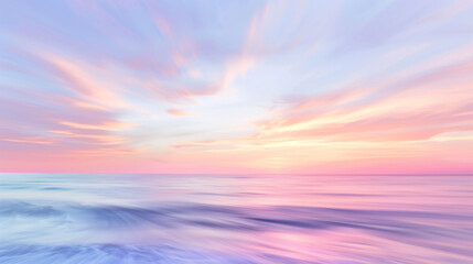 Obraz premium Blurred pastel sunset over the ocean with streaks of light and color