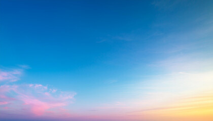 Obraz premium A breathtaking sunset sky with vibrant colors and soft clouds, creating a peaceful and serene atmosphere