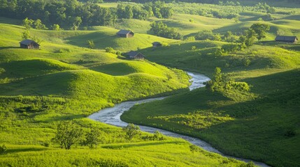 Obraz premium Tranquil Countryside Vista: Rolling Hills, Meandering Stream, and Rustic Farmhouses Scenery